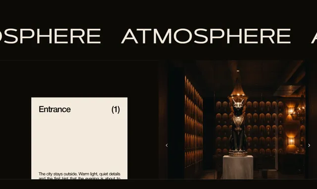 Слайдер «Atmosphere»: вхід до ресторану з фірмовою статуєю кота